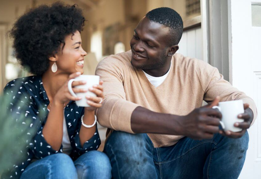 couple talking and drinking coffee