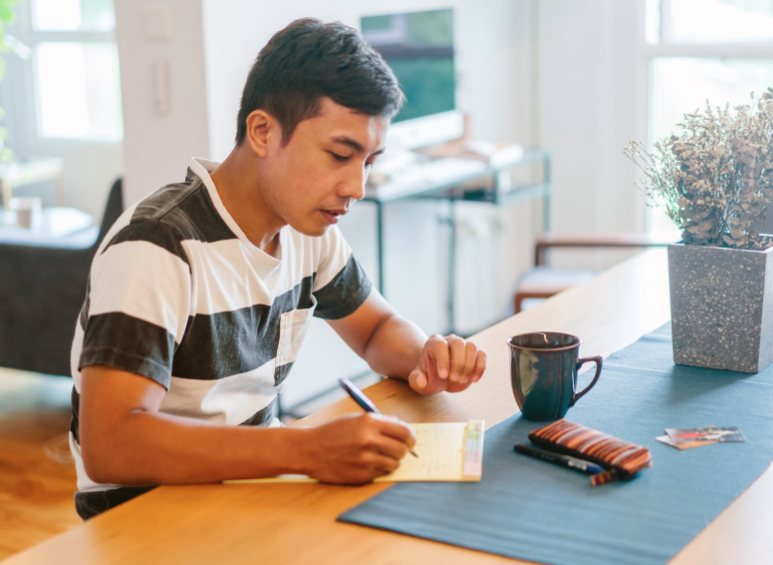 man completing paperwork